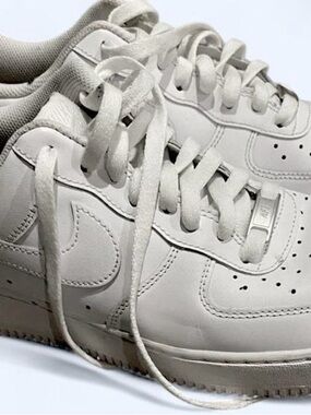 Nike Air Force 1 Low “Triple White” sneakers in Size 10.
